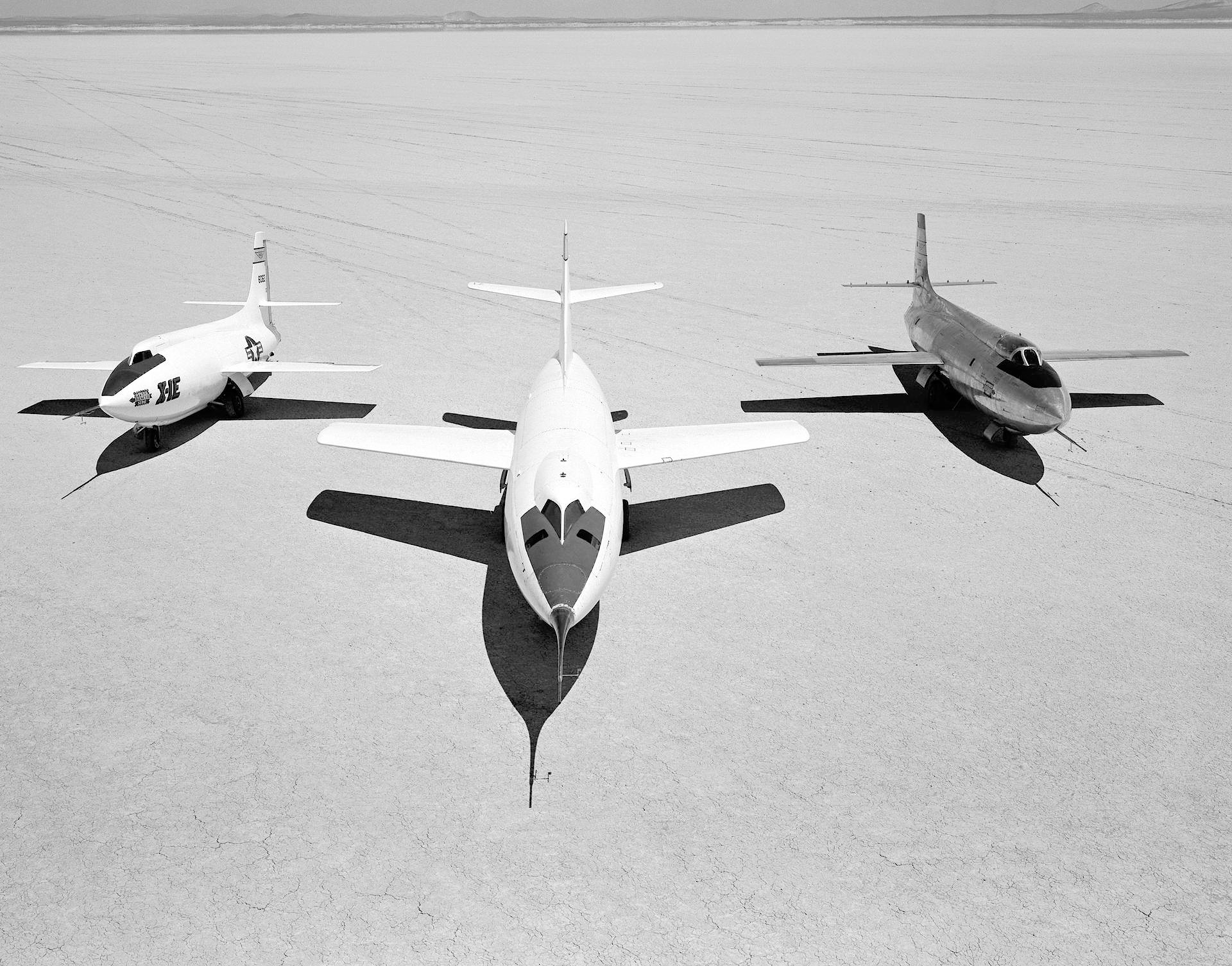 Early NACA research aircraft on the lakebed at the High Speed Research Station in 1955: Left to right: X-1E, D-558-II, X-1B